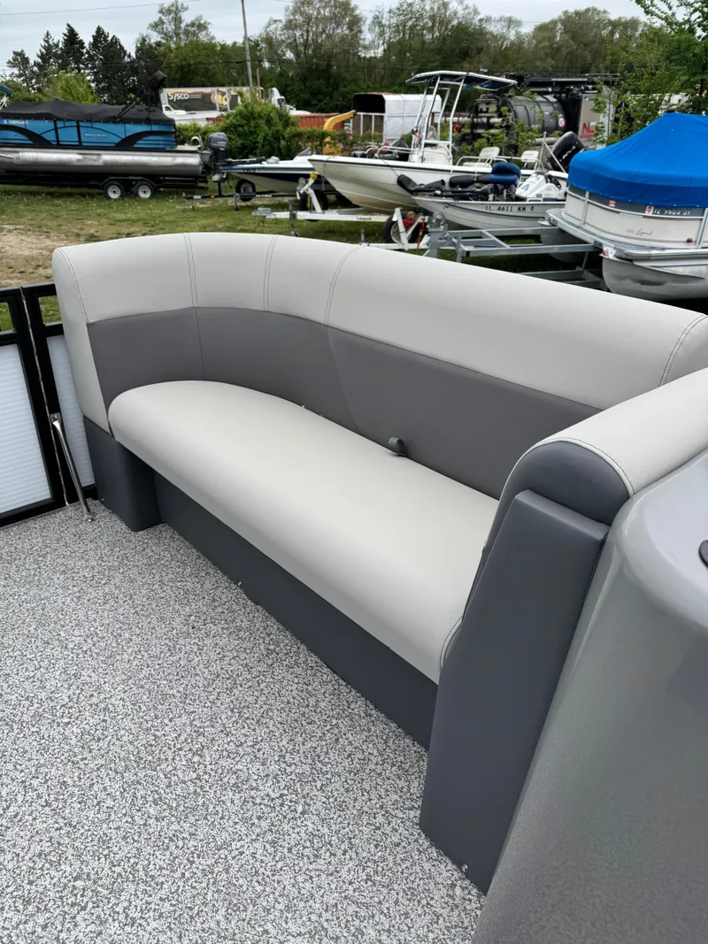 Slide: The Image of 2025 Angler Quest 816 Panfish Cruise boat with gray seating on deck. - 9