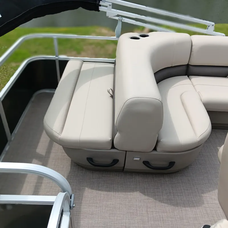 Slide: The Image of 2025 Sun Tracker Party Barge 18 DLX with beige seating and cup holders. - 11