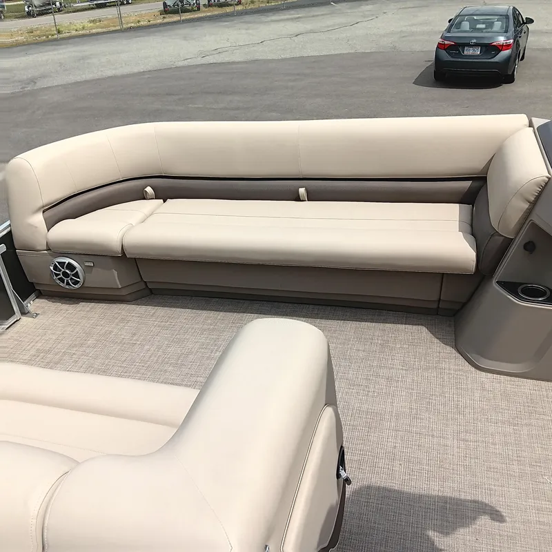 Slide: The Image of 2025 Sun Tracker Party Barge 18 DLX with beige seating and spacious deck. - 7