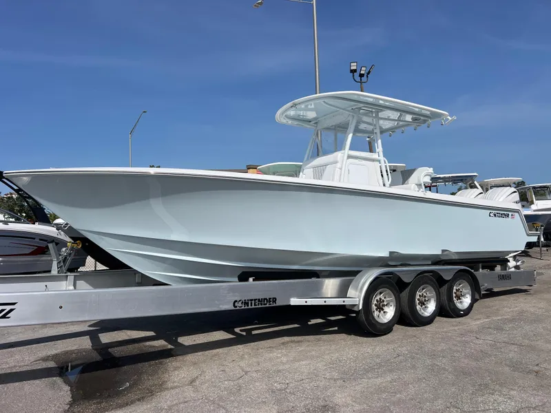 Slide: The Image of 2025 Contender 30 ST boat on trailer, sleek design, ready for adventure. - 1