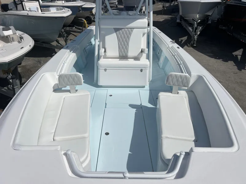 Slide: The Image of 2025 Contender 30 ST boat interior with white seating and center console. - 15