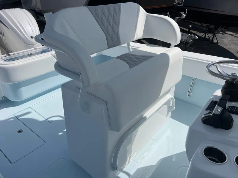 Slide: The Image of 2025 Contender 30 ST boat seat with white and gray upholstery, featuring a sleek design. - 18