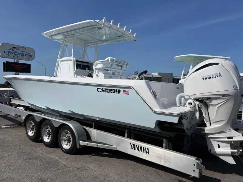 Slide: The Image of 2025 Contender 30 ST boat on a Yamaha trailer, displayed outdoors. - 4