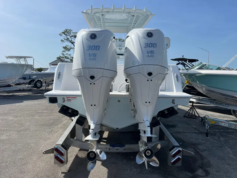 Slide: The Image of 2025 Contender 30 ST boat with dual 300 V6 engines, rear view. - 5