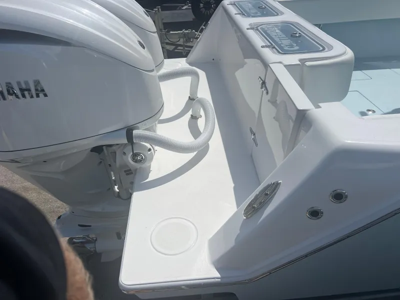 Slide: The Image of 2025 Contender 30 ST boat with Yamaha outboard engines, featuring a sleek white deck design. - 6