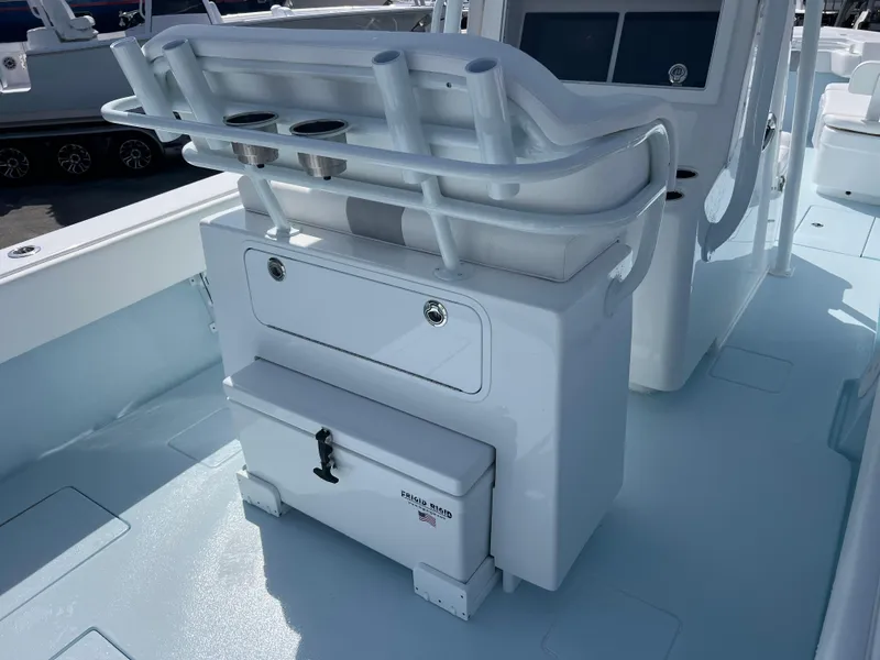 Slide: The Image of 2025 Contender 30 ST boat interior with storage and seating area. - 9