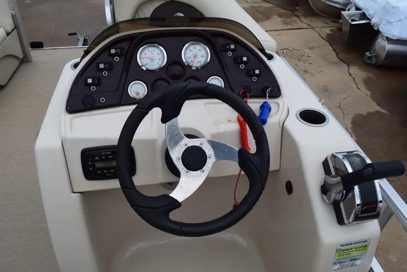 Slide: The Image of Steering console of 2014 SunChaser Classic Cruise 8520 pontoon boat with gauges and controls. - 10