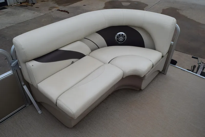 Slide: The Image of 2014 SunChaser Classic Cruise 8520 boat seating, beige and brown upholstery, outdoor setting. - 11