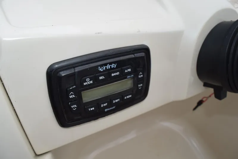 Slide: The Image of Infinity stereo system on 2014 SunChaser Classic Cruise 8520 boat dashboard. - 14