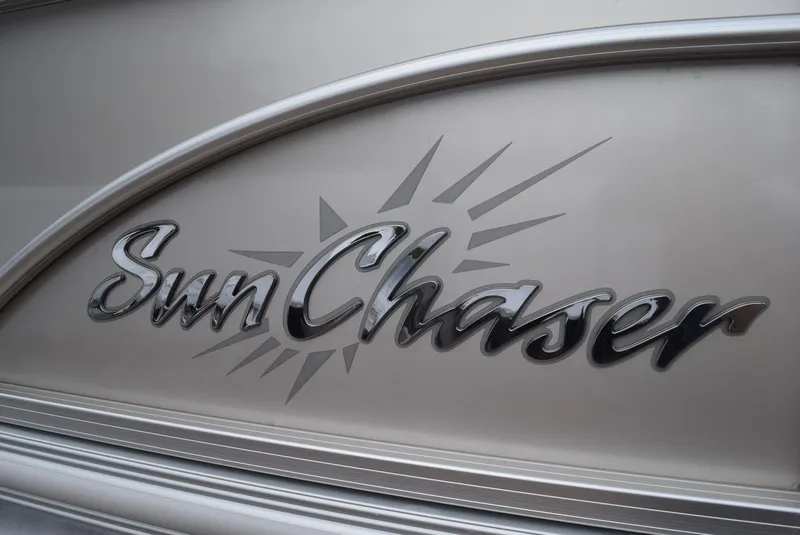 Slide: The Image of SunChaser Classic Cruise 8520 logo on a 2014 model boat, featuring sleek metallic design. - 7