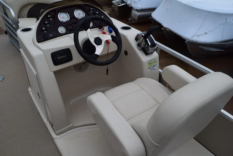 Slide: The Image of 2014 SunChaser Classic Cruise 8520 boat helm with steering wheel and controls. - 9