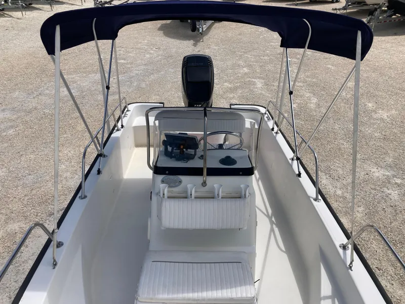 Slide: The Image of 2005 Boston Whaler 170 Montauk boat with canopy and seating, viewed from above. - 11