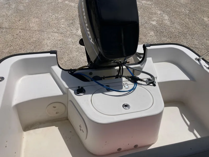 Slide: The Image of 2005 Boston Whaler 170 Montauk boat engine and deck view. - 13