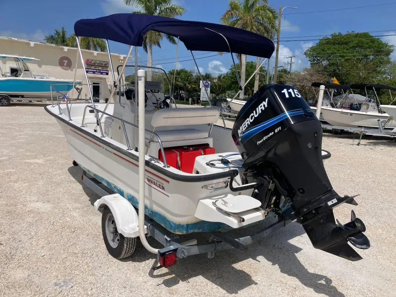 Slide: The Image of 2005 Boston Whaler 170 Montauk boat with Mercury 115 engine on trailer. - 4