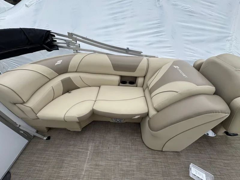 Slide: The Image of 2019 Starcraft EX 20 R boat interior with beige and tan seating. - 7