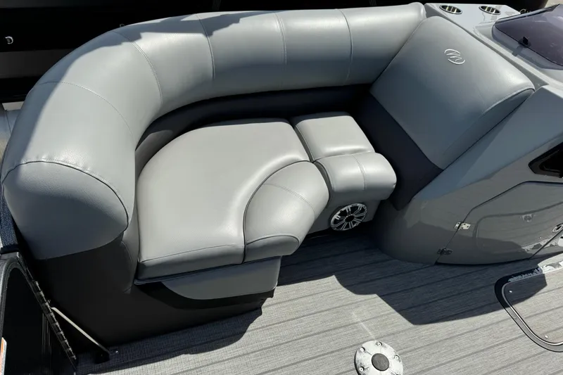 Slide: The Image of Luxurious seating on 2020 Manitou Oasis SR pontoon boat, featuring sleek gray upholstery. - 12