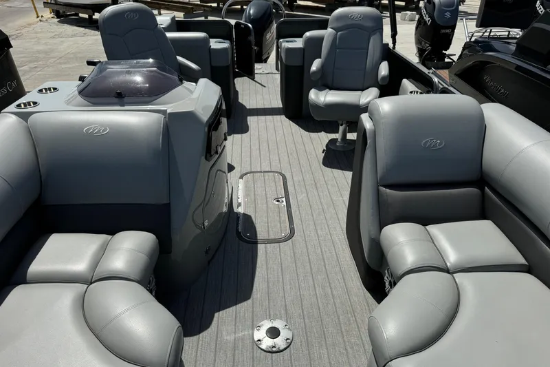 Slide: The Image of 2020 Manitou Oasis SR pontoon boat interior with gray seating and spacious layout. - 15