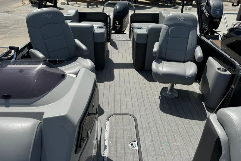 Slide: The Image of 2020 Manitou Oasis SR pontoon boat interior with gray seating and spacious layout. - 5