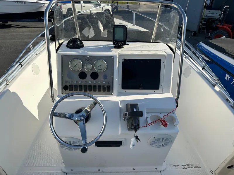 Slide: The Image of 2008 Key West 186 Sportsman boat console with steering wheel and navigation instruments. - 3