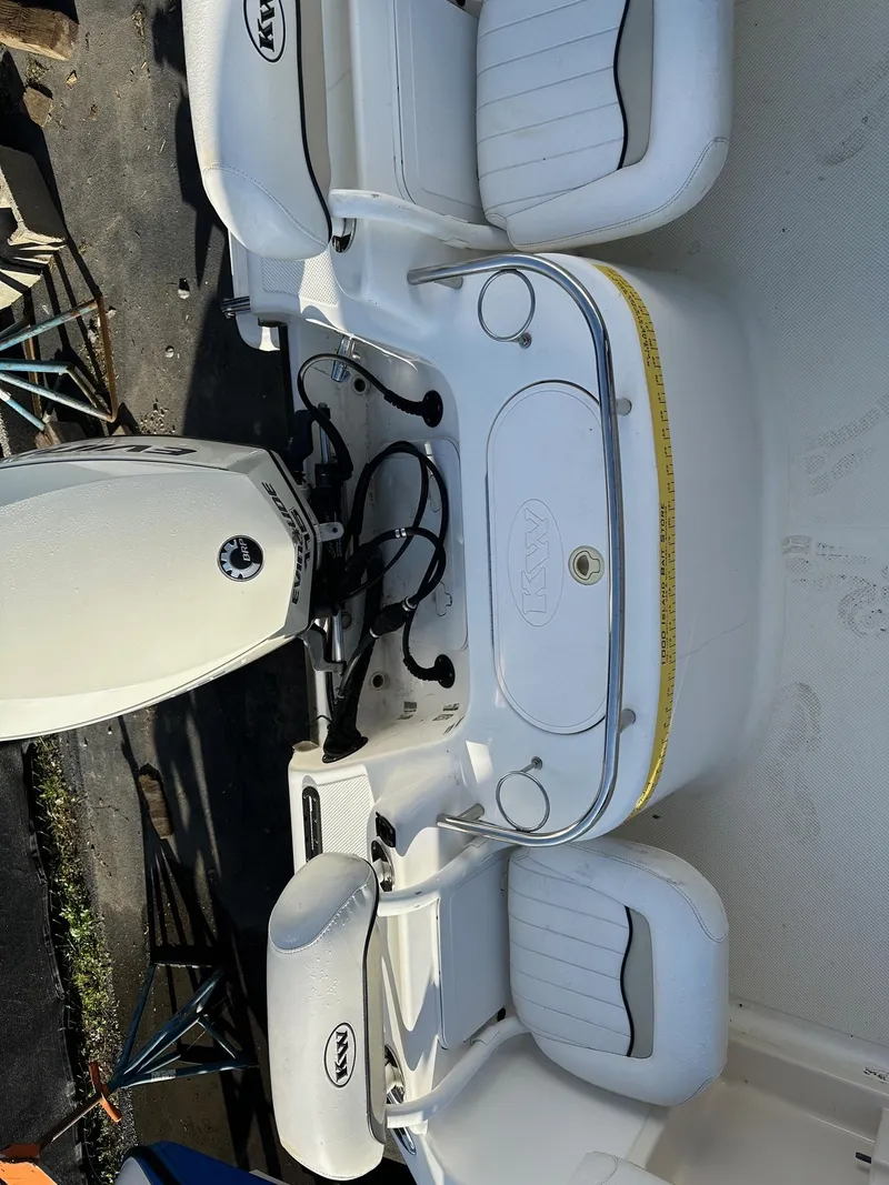 Slide: The Image of 2008 Key West 186 Sportsman boat interior with seating and engine view. - 6