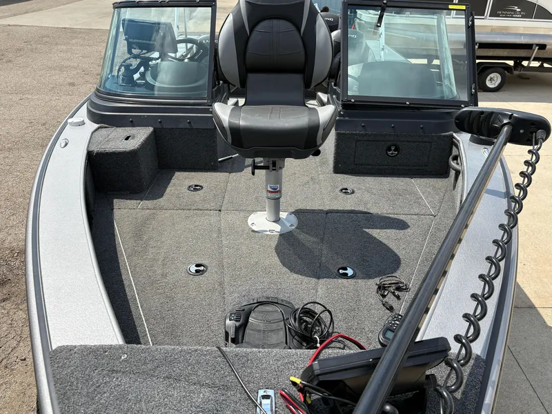 Slide: The Image of 2021 Lund 1975 Pro-V boat interior with seating and equipment. - 10