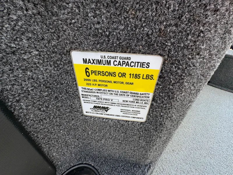 Slide: The Image of U.S. Coast Guard capacity label on 2021 Lund 1975 Pro-V boat, 6 persons or 1185 lbs. - 22