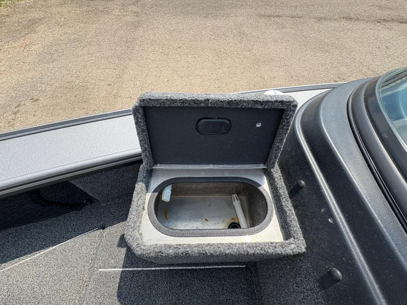 Slide: The Image of Open storage compartment on 2021 Lund 1975 Pro-V boat, showing interior details. - 27