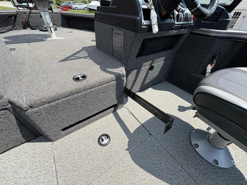 Slide: The Image of Interior of a 2021 Lund 1975 Pro-V boat showing seating and control area. - 35