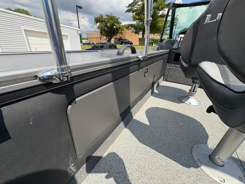 Slide: The Image of 2021 Lund 1975 Pro-V boat interior with seating and storage compartments. - 37