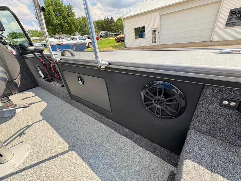 Slide: The Image of Interior of 2021 Lund 1975 Pro-V boat with speaker and storage compartment. - 38