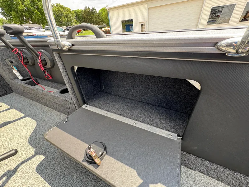 Slide: The Image of Open storage compartment in a 2021 Lund 1975 Pro-V boat, showcasing interior space. - 39