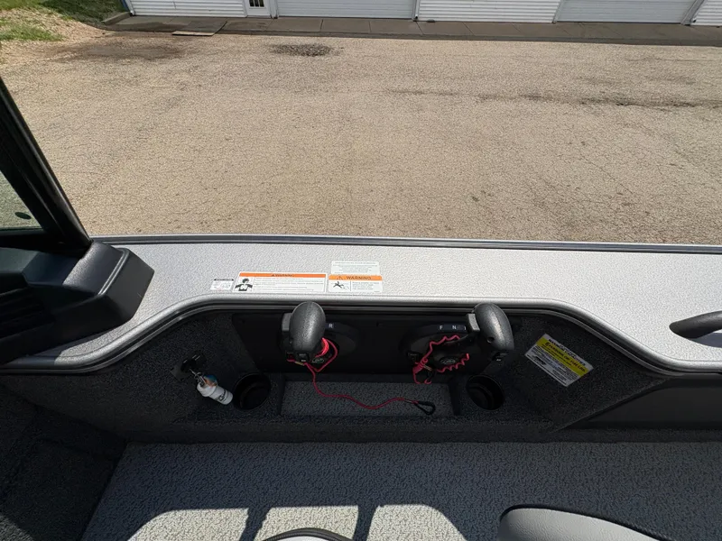 Slide: The Image of Interior view of a 2021 Lund 1975 Pro-V boat, showcasing seating and control panel. - 40