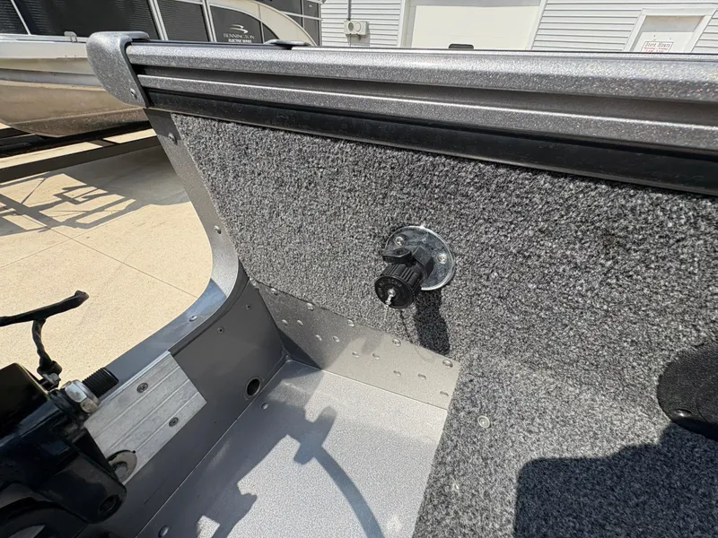 Slide: The Image of Interior view of a 2021 Lund 1975 Pro-V boat, featuring a textured panel. - 43