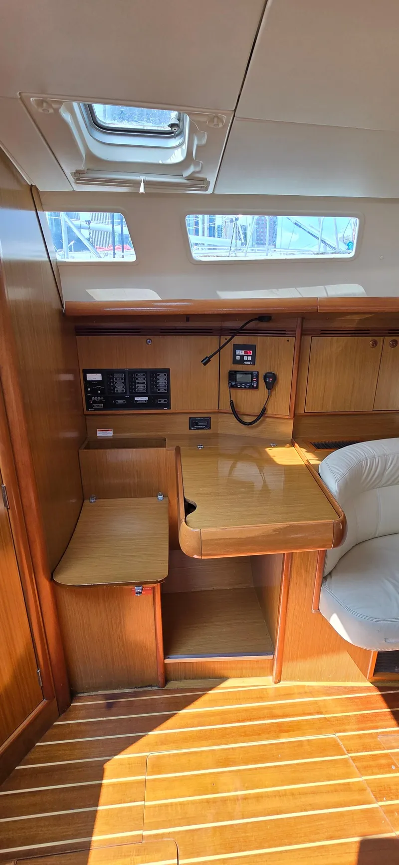 Slide: The Image of Interior of 2006 Jeanneau Sun Odyssey 40.3 sailboat with wooden finish and navigation station. - 11