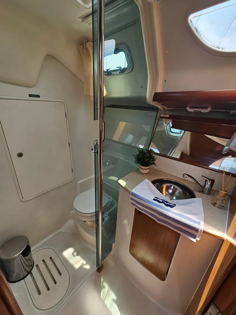 Slide: The Image of 2006 Jeanneau Sun Odyssey 40.3 yacht bathroom with modern fixtures and natural light. - 15