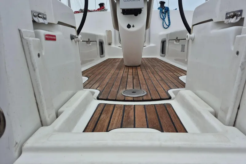 Slide: The Image of Cockpit of 2006 Jeanneau Sun Odyssey 40.3 with teak flooring and steering console. - 5