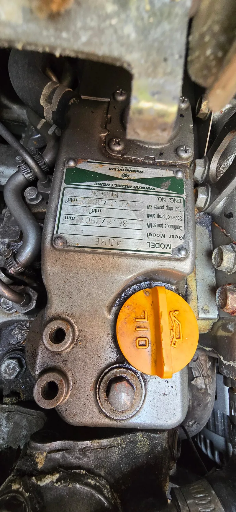 Slide: The Image of Engine component of a 2006 Jeanneau Sun Odyssey 40.3 sailboat, featuring an oil cap. - 9