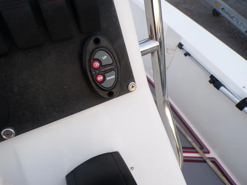 Slide: The Image of Control panel on a 2006 Mako 1801 Inshore boat, featuring up and down buttons. - 11