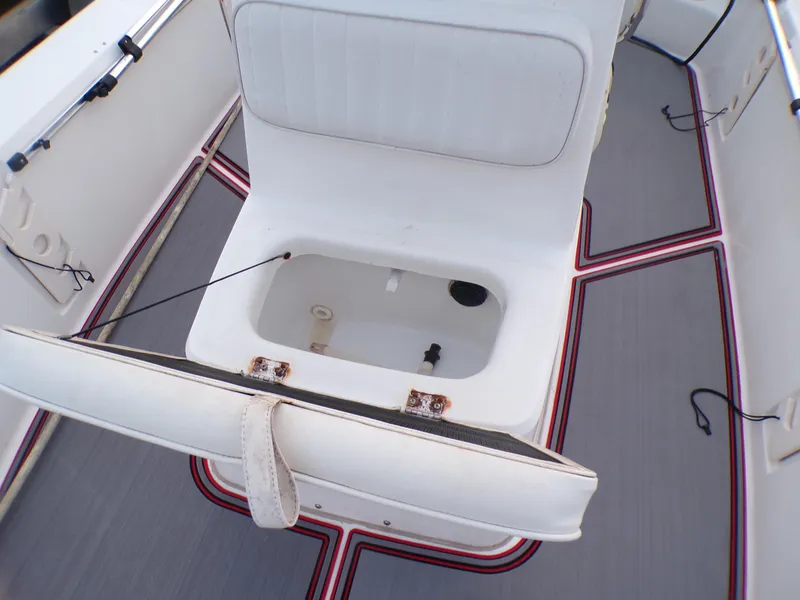 Slide: The Image of 2006 Mako 1801 Inshore boat interior with open storage compartment. - 14