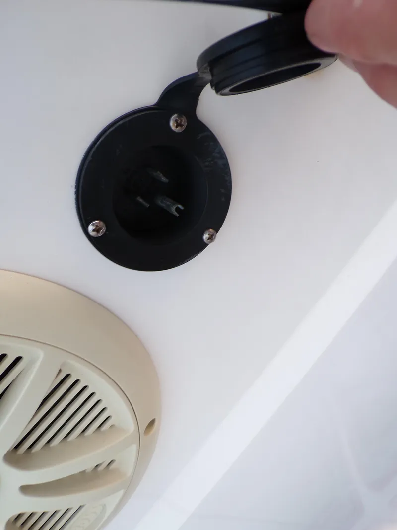 Slide: The Image of 2006 Mako 1801 Inshore boat speaker and power outlet detail. - 15
