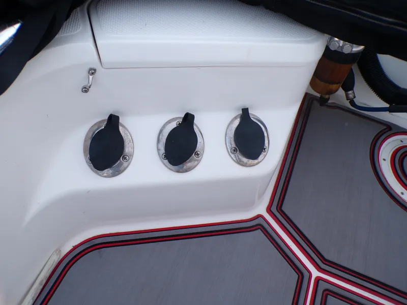 Slide: The Image of 2006 Mako 1801 Inshore boat deck with three covered outlets. - 16