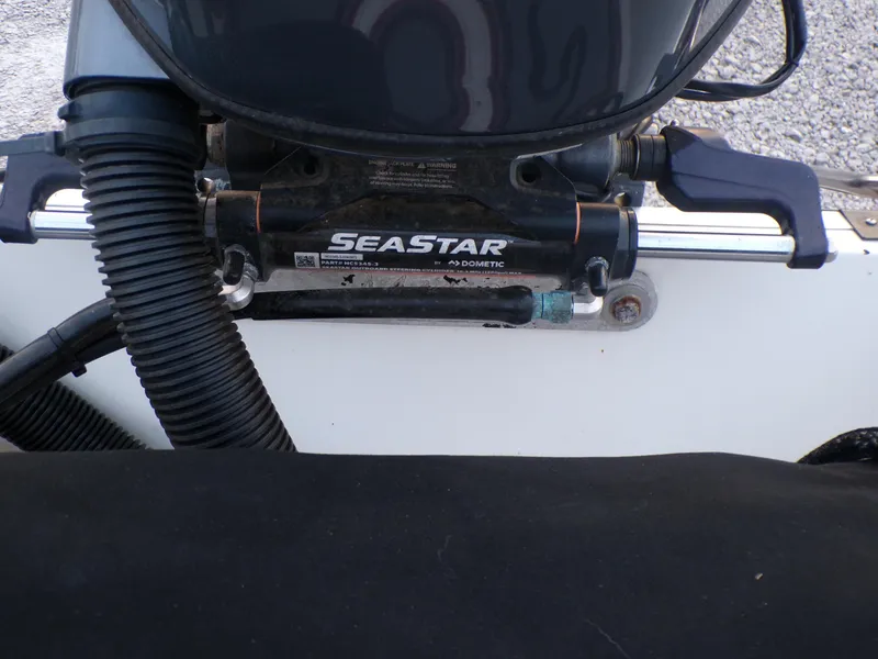 Slide: The Image of Hydraulic steering system on a 2006 Mako 1801 Inshore boat, featuring SeaStar components. - 18