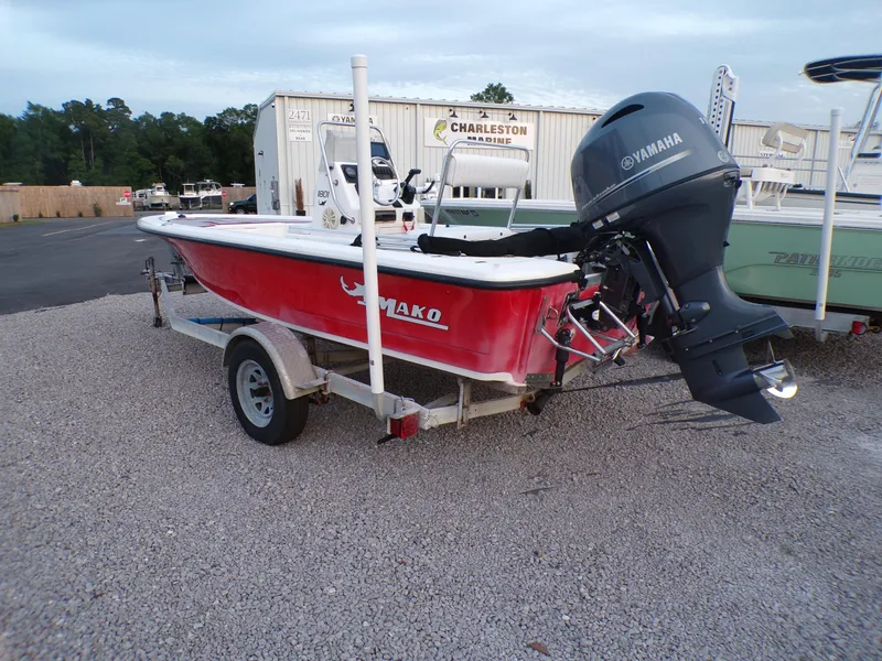 Slide: The Image of 2006 Mako 1801 Inshore boat with Yamaha outboard motor on a trailer. - 3