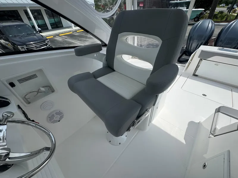 Slide: The Image of 2025 Albemarle 31 Dual Console boat interior with gray and white seating. - 20