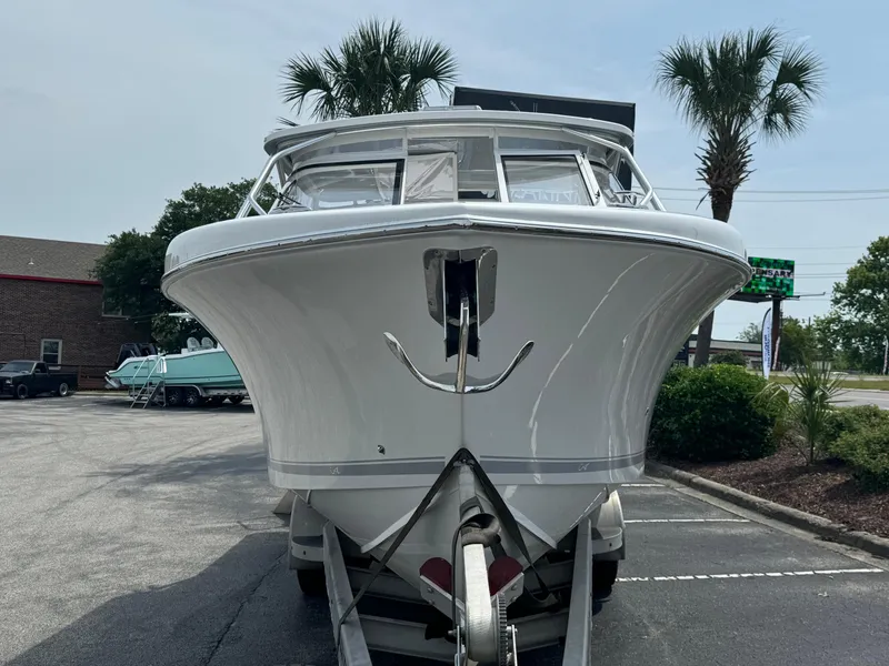 Slide: The Image of 2025 Albemarle 31 Dual Console boat cruising on a scenic waterway. - 3