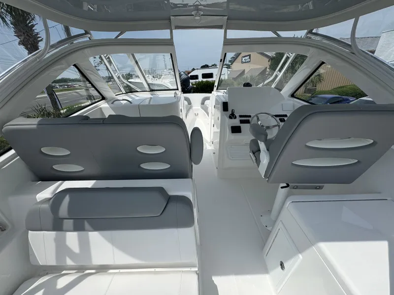 Slide: The Image of 2025 Albemarle 31 Dual Console boat on water, featuring triple outboard engines. - 6