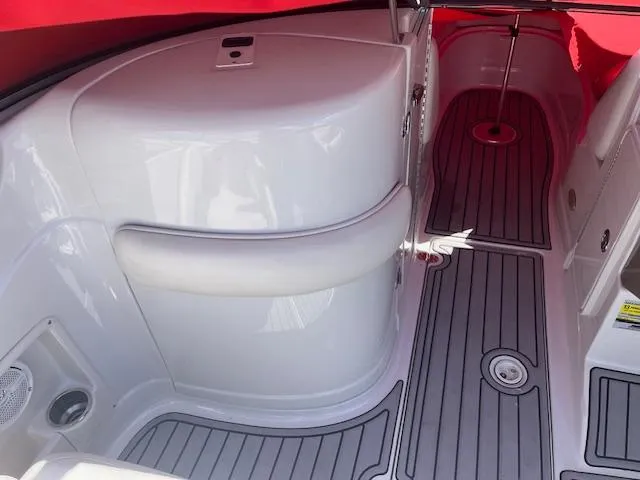 Slide: The Image of 2007 Crownline 240 EX boat interior with sleek white seating and gray flooring. - 11