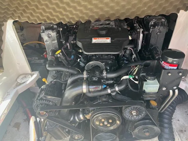 Slide: The Image of Engine of a 2007 Crownline 240 EX boat, showcasing detailed components and layout. - 13