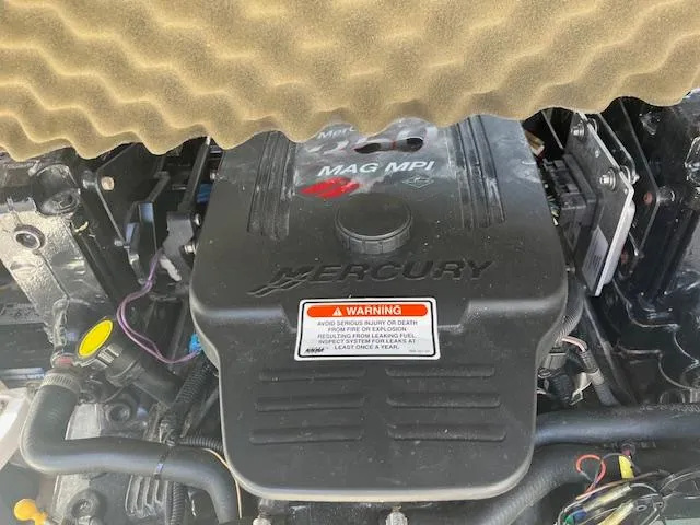 Slide: The Image of Mercury engine in a 2007 Crownline 240 EX boat, featuring MAG MPI technology. - 14