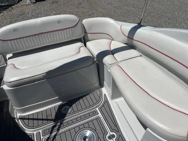 Slide: The Image of 2007 Crownline 240 EX boat interior with white seating and red accents. - 6